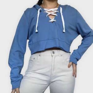 Light blue cropped hooded sweater with crisscross